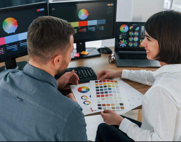 top-view-two-designers-working-together-in-the-of-2023-11-27-04-51-18-utc