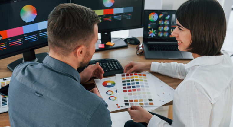 top-view-two-designers-working-together-in-the-of-2023-11-27-04-51-18-utc