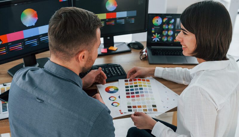 top-view-two-designers-working-together-in-the-of-2023-11-27-04-51-18-utc